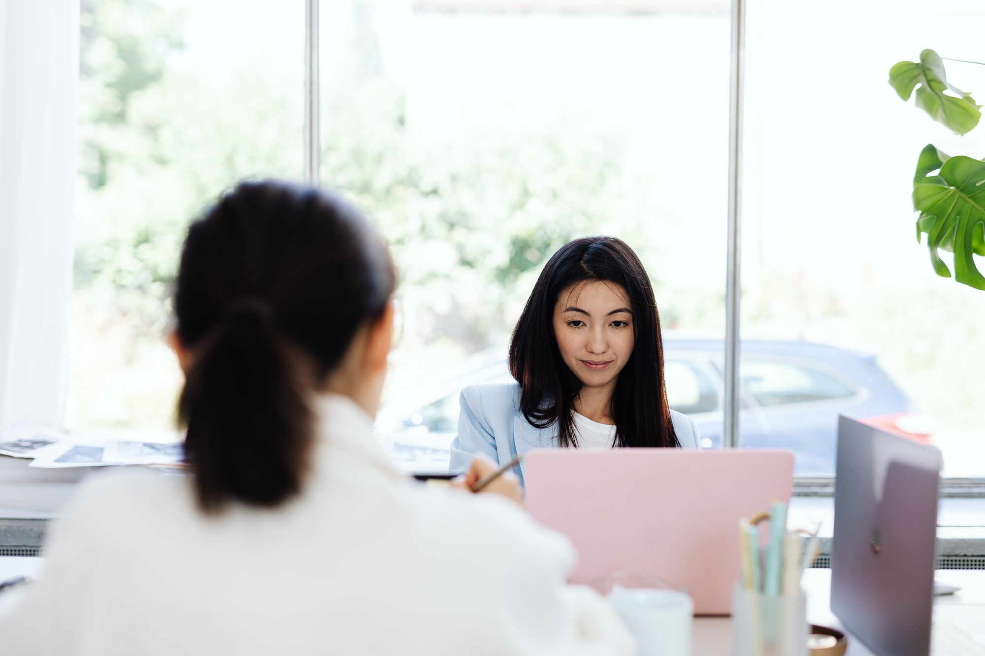A manager mediating a conversation between two team members