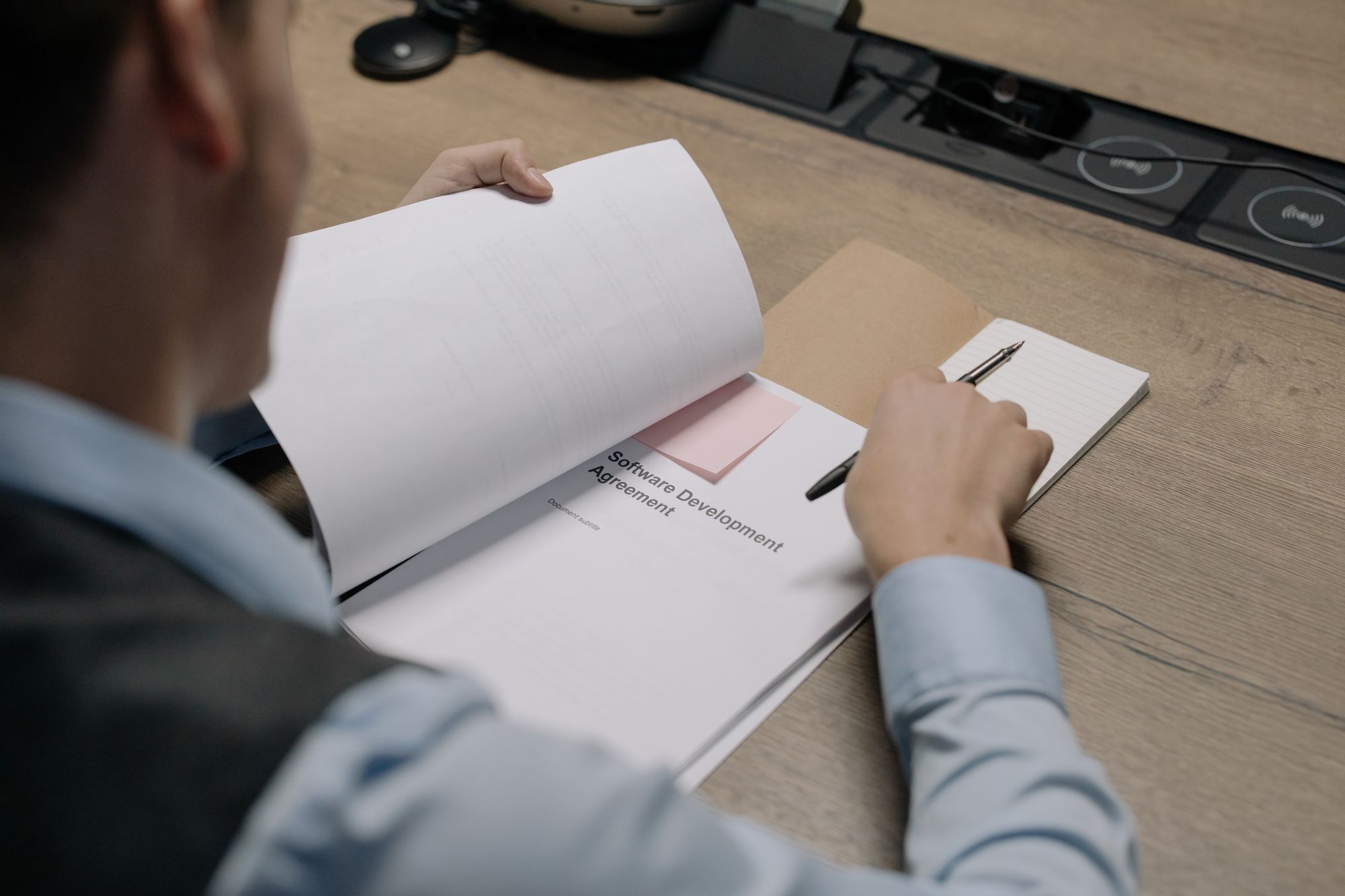 A practice manager reviewing vendor contracts and options